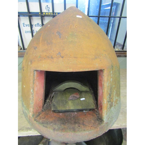 2060 - A weathered clay/terracotta helmet shaped bread oven impressed number 10, 56 cm high (af)