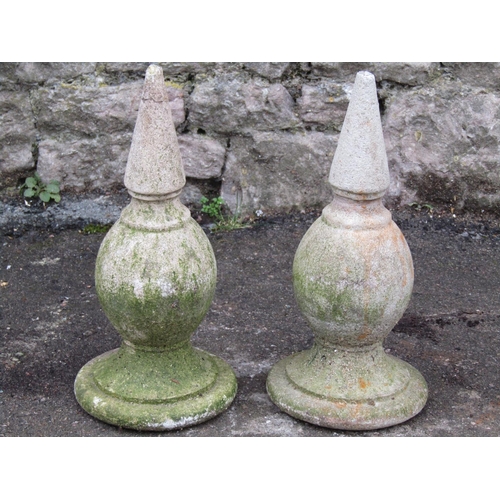 2067 - A pair of small weathered cast composition stone finials, 36 cm high (af)