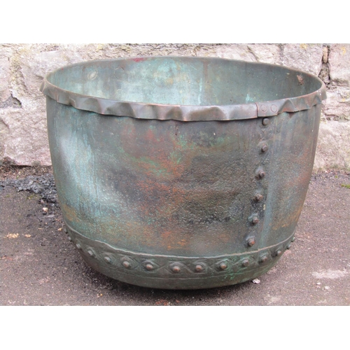 2071 - An antique weathered copper cauldron/log bin with pop riveted and seams and folded rim, 46 cm diamet... 