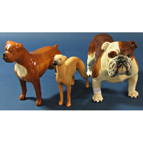 1072 - A collection of various Beswick dogs to include Bulldog, St Bernard, Dalmatian, Setter, etc (8)