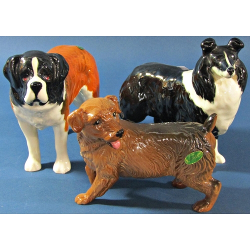 1072 - A collection of various Beswick dogs to include Bulldog, St Bernard, Dalmatian, Setter, etc (8)