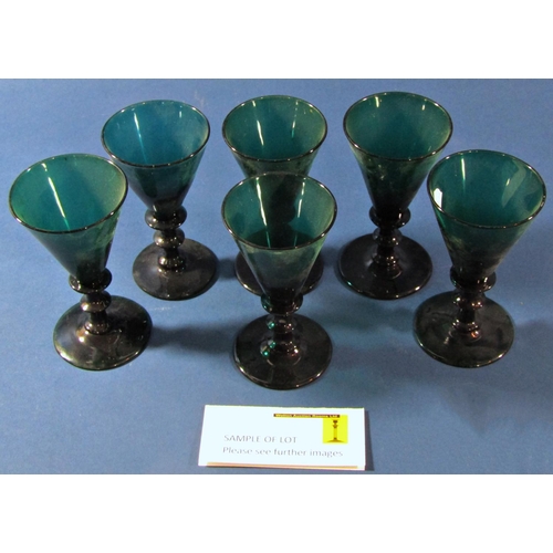 1082 - Six 19th century green glass stemmed wine glasses, with trumpet shaped bowls on long stems, five fur... 