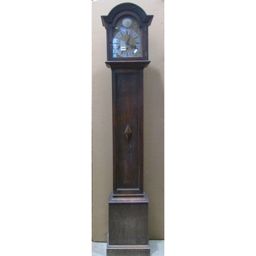 2102 - An Edwardian/1920's grandmother clock, the oak case with applied split mouldings and arched hood enc... 