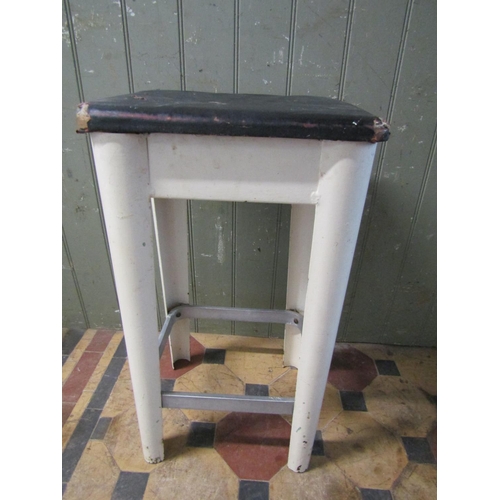 2079 - A vintage painted aluminium industrial stool with rectangular rexine/oil cloth upholstered seat rais... 