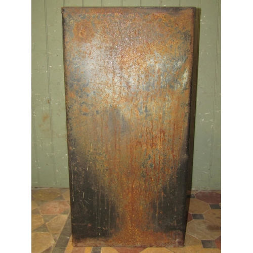 2080 - A vintage industrial steel floorstanding side cabinet enclosed by a single door flanked by rounded c... 