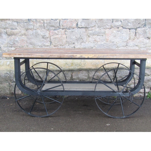 2088 - A good decorative low platform cart display/occasional table with rectangular distressed wooden top ... 