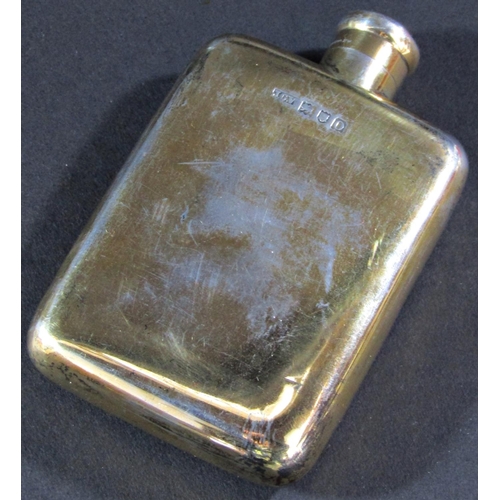 1197 - A silver hip flask, London 1909, maker John Collard Vickery, and two silver capped glass vanity bott... 