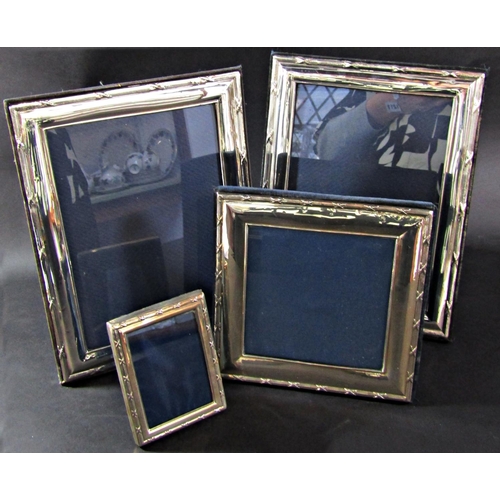 1211 - Four near matching silver photo frames by various makers, 2 x 20 x 14 cm opening, one at 12 x 12 cm ... 