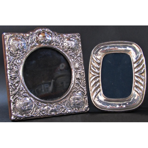 1212 - Three silver photo frames with circular openings, various designs, and a single photo frame with ova... 