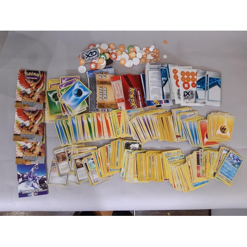 333 - Collection of Pokemon cards, counters and rule books together with a large Pokemon soft toy, 2 card ... 