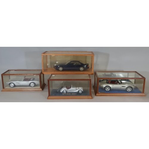 350 - 4 cased models of BMW cars comprising 1:18 scale 850i by Revell in timber/perspex case, BMW 507 by R... 