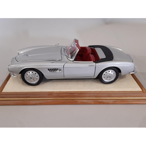 350 - 4 cased models of BMW cars comprising 1:18 scale 850i by Revell in timber/perspex case, BMW 507 by R... 