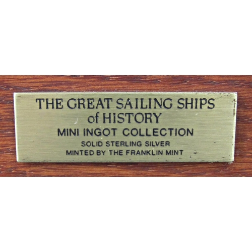 1217 - A Franklin Mint collection of Ships Of The World ingots, 50 - each 3 grams, housed in an oak box wit... 