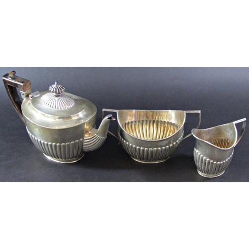 1220 - A silver three piece tea service, London 1897, makers mark rubbed, 26 ozs all in