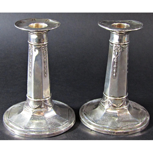 1229 - A pair of silver octagonal column candlesticks with flared bases, Sheffield 1919, maker James Dixon ... 