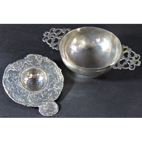 1230 - A silver quaich with double pierced handles, London 1890, maker Wakeley & Wheeler, 14 cm wide, a con... 