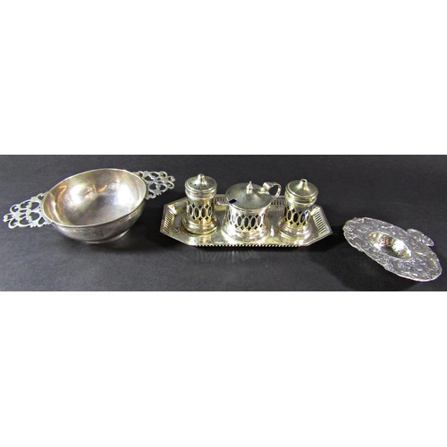 1230 - A silver quaich with double pierced handles, London 1890, maker Wakeley & Wheeler, 14 cm wide, a con... 