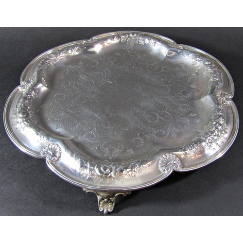 1239 - A Victorian silver tray, heavily engraved, raised on three supports, maker Elkington, Birmingham 186... 