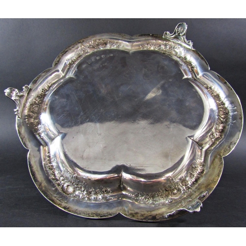 1239 - A Victorian silver tray, heavily engraved, raised on three supports, maker Elkington, Birmingham 186... 