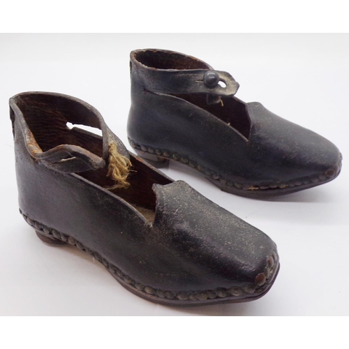 1416 - A pair of 19th century child's shoes - North Country, with leather uppers, timber soles and ironwork... 