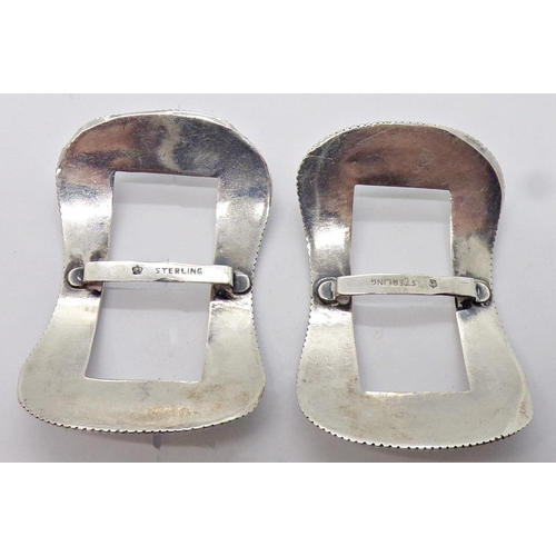 1426 - A pair of sterling silver buckles with beaded borders, further crucifix, eastern white metal jewelle... 