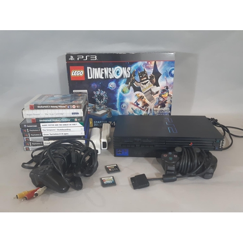 332 - PS2 console, 2 controllers and a collection of games including  sealed  box 'Lego Dimensions' for PS... 