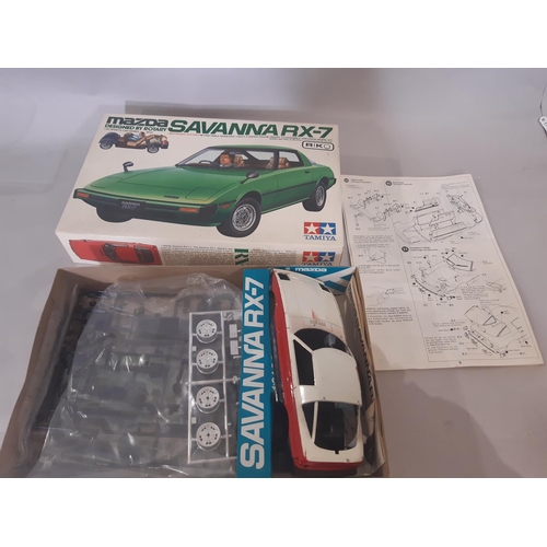 348 - Mixed lot: 4 boxed model car kits  which appear un-started comprising Mazda Savannah by Tamiya, BMW ... 