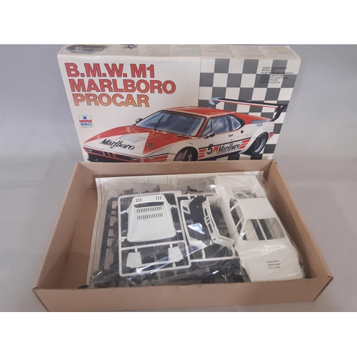 348 - Mixed lot: 4 boxed model car kits  which appear un-started comprising Mazda Savannah by Tamiya, BMW ... 