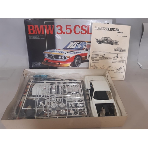 348 - Mixed lot: 4 boxed model car kits  which appear un-started comprising Mazda Savannah by Tamiya, BMW ... 