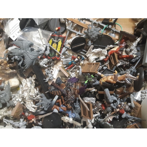 338 - Large quantity of unsorted modelling parts for creating Warhammer type figures including some comple... 