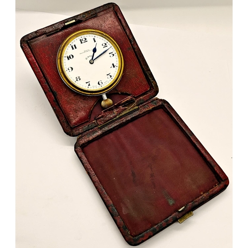 1381 - A silver mounted travelling watch case holding a silver plated cased watch with enamelled dial, the ... 