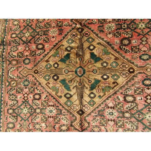 1662 - A North West Persian Malayer Rug, with a central diamond shaped medallion and repetitive geometric p... 