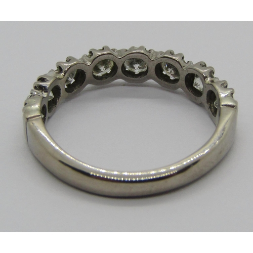 1329 - 18ct white gold diamond half hoop ring, set with eight stones each 0.15ct approx, size L, 3.1g