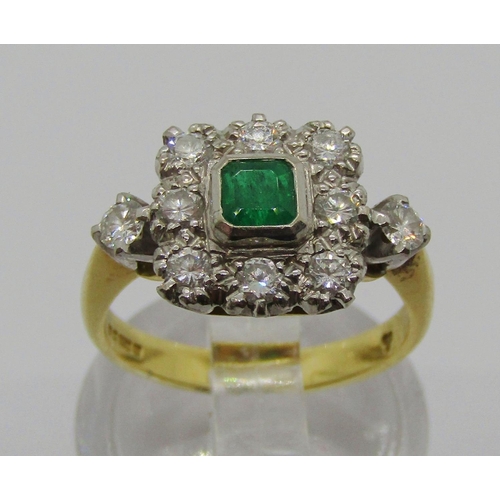 1332 - 1980s 18ct emerald and diamond square cluster ring, the bezel set emerald 3 x 3mm approx, size J, 4g