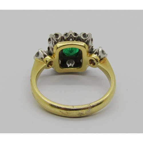 1332 - 1980s 18ct emerald and diamond square cluster ring, the bezel set emerald 3 x 3mm approx, size J, 4g