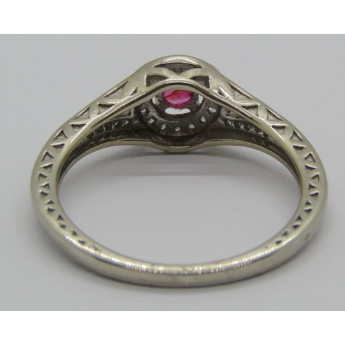 1338 - 14k white gold ruby and diamond halo style ring, size O/P, 2.7g