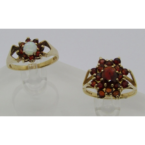 1346 - Two 9ct garnet cluster rings including one set with a central opal, 5.5g total