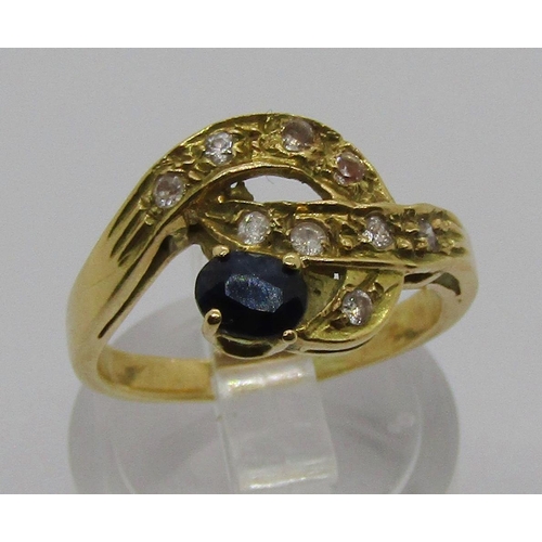 1348 - Stylised yellow metal sapphire ring, set with white stones (one white stone tests as a diamond), siz... 