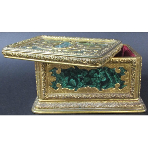 1430 - A fine quality antique casket, the engraved gilded framework enclosing malachite panels, to the cent... 