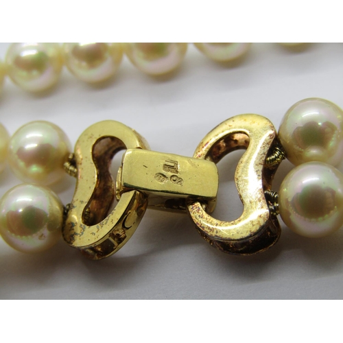 1362 - Double strand faux pearl necklace with clasp stamped '750', together with a matching bracelet (2)