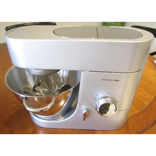 1464 - A Kenwood Chef food mixer and the Kenwood Chef food processor attachment, an assortment of blades, w... 