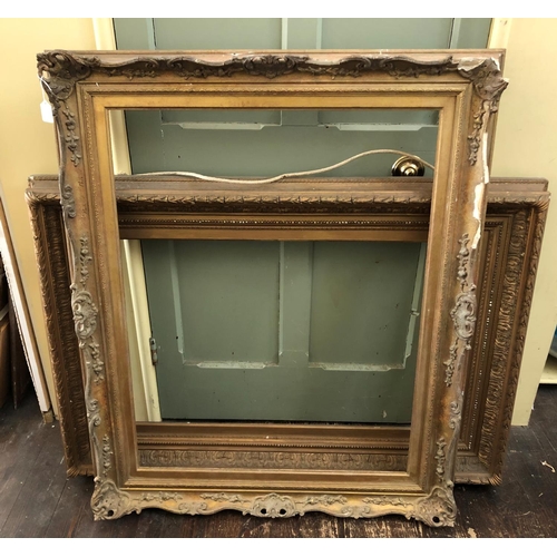 75 - Two Victorian Gilt Wood and Gesso Frames with laurel leaf details (84 x 122 cm) and scrolling Rococo... 