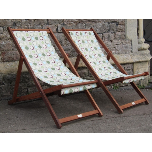 2017 - A pair of contemporary folding hardwood deck chairs