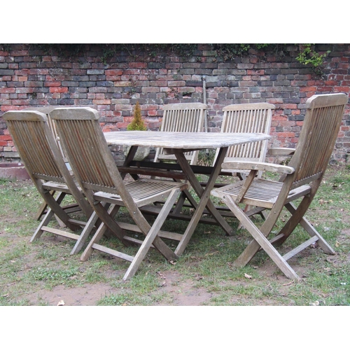 2050 - A weathered teak rectangular folding garden table with canted corners and slatted top, 150 cm x 80 c... 