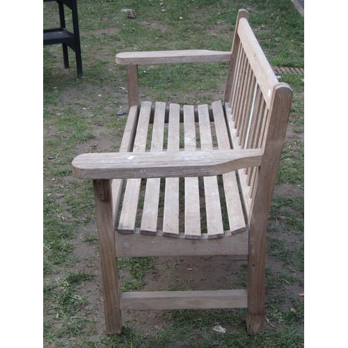 2052 - A weathered teak garden bench with slatted seat and back, 154 cm wide (af)