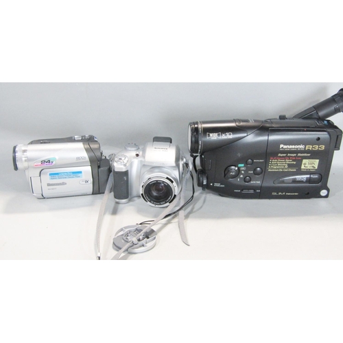 1497 - Photographic equipment: A FujiFilm S304, two Canon Sure Shot cameras, video cameras, a Philips mini ... 