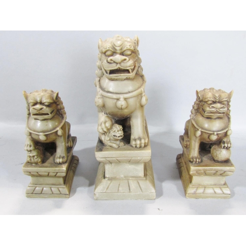 1518 - Two Chinese hardwood carved figures of wise old men together with three stone effect dogs of Fo (5)