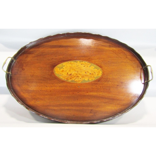 1453 - A large oval Edwardian mahogany tray with central inlaid oak leaves and acorns with two brass carryi... 