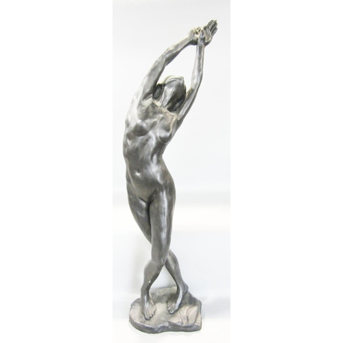 1470 - A bronze effect statue of a female nude in a balletic pose, 60cm tall.