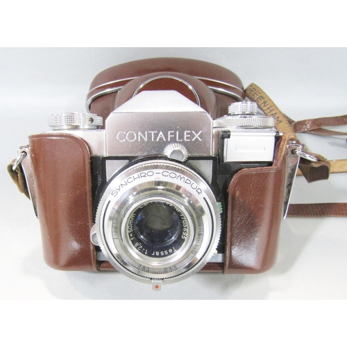 1473 - A Zeiss Contaflex camera circa 1950’s in it’s original case and manual together with associate lens,... 